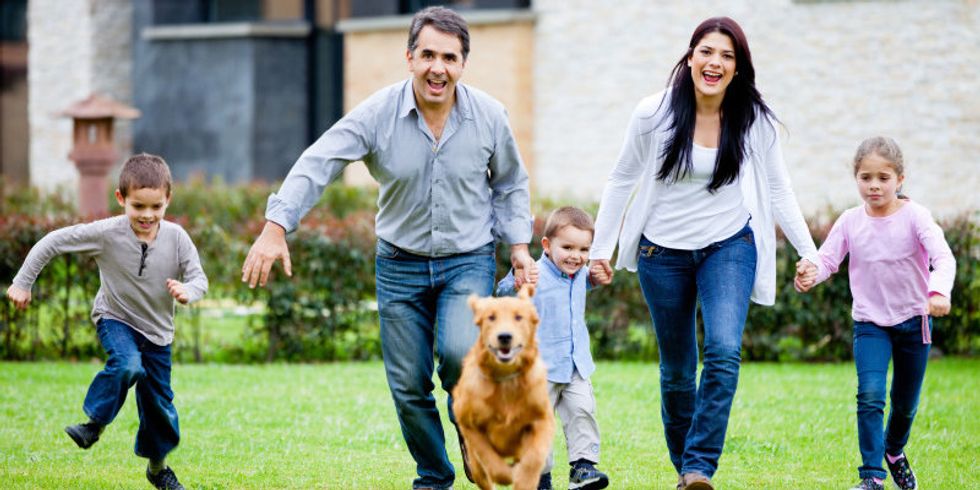 Family running with dog