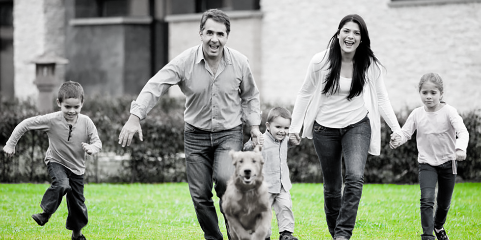 Family running with dog