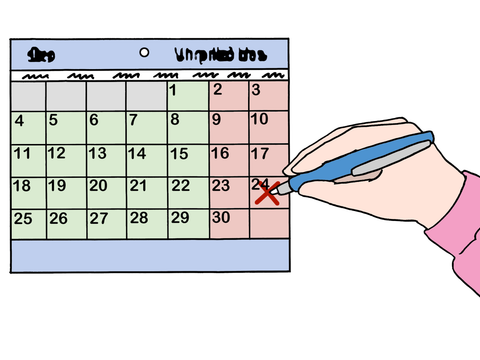 Eine Hand schreibt etwas in einen Kalender und markiert ein Datum