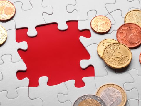 Münzen auf Puzzle