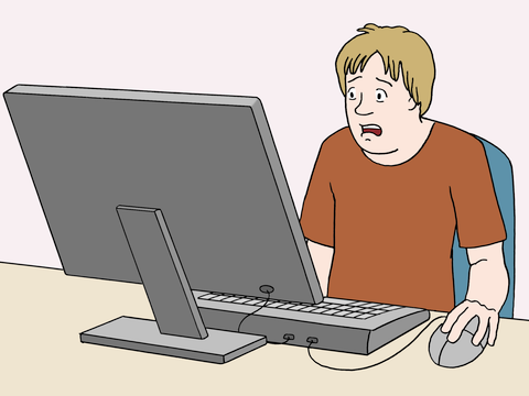 Eine Person sitzt am PC und informiert sich